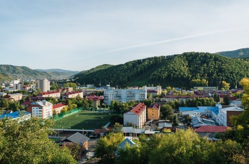 a view of a city with mountains in the background